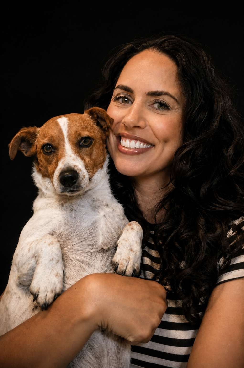 Natasha Joy Brady smiling and holding her dog